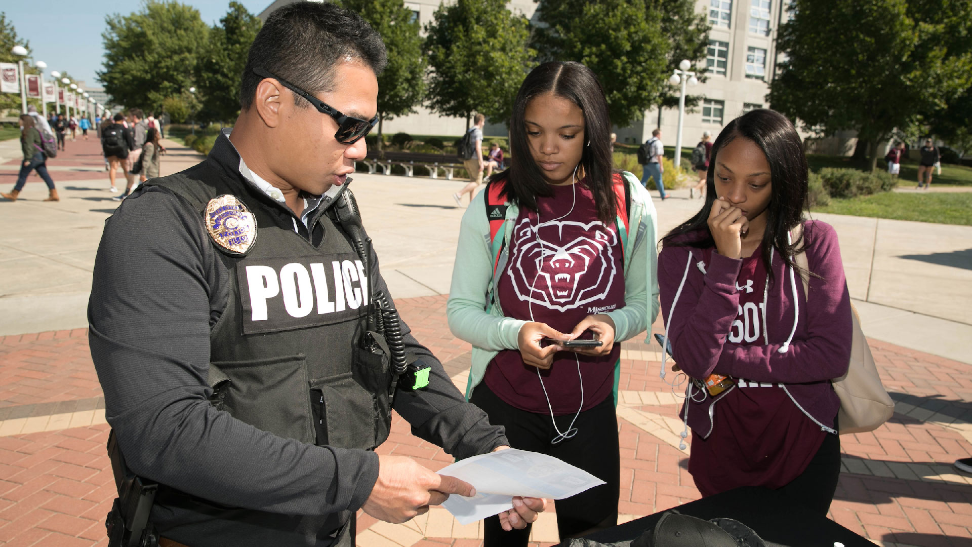 Criminology and criminal justice students talk with police officer