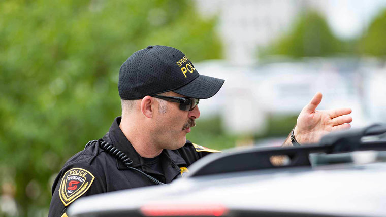 Police officer giving instructions to driver.