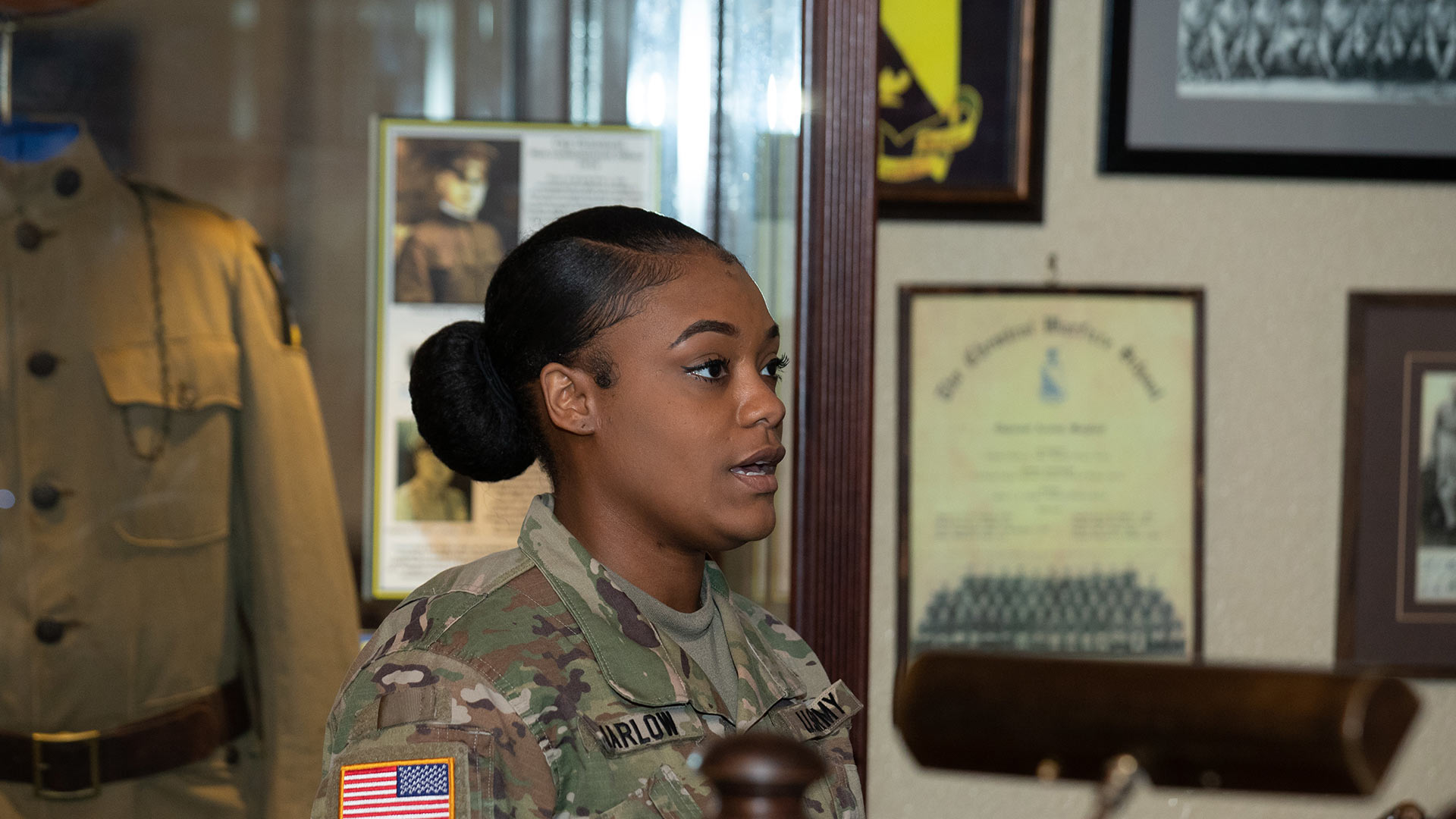 Soldier in uniform during commencement ceremony.